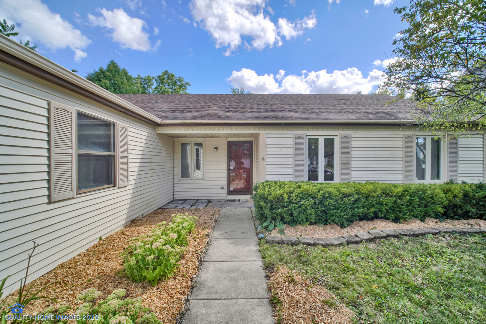 27W241 Churchill Road Winfield, IL 60190 - Photo 2 of 24 a front view of a house with a yard