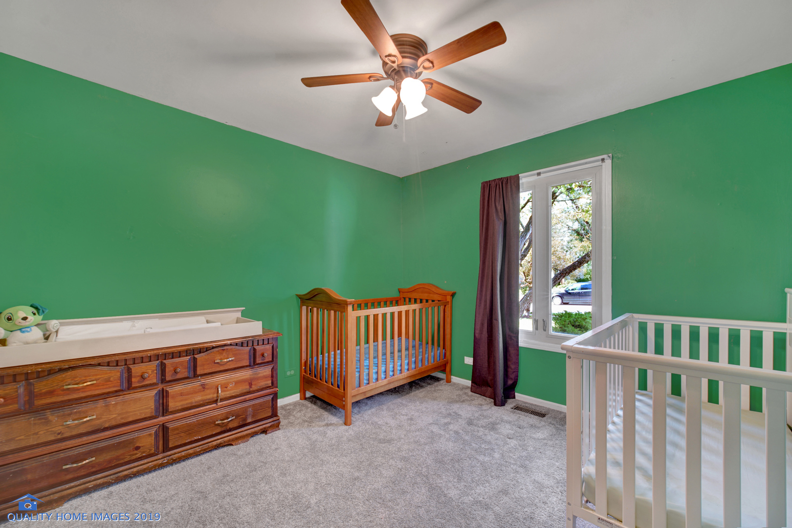 27W241 Churchill Road Winfield, IL 60190 - Photo 15 of 24 a view of a room with furniture and a chandelier fan