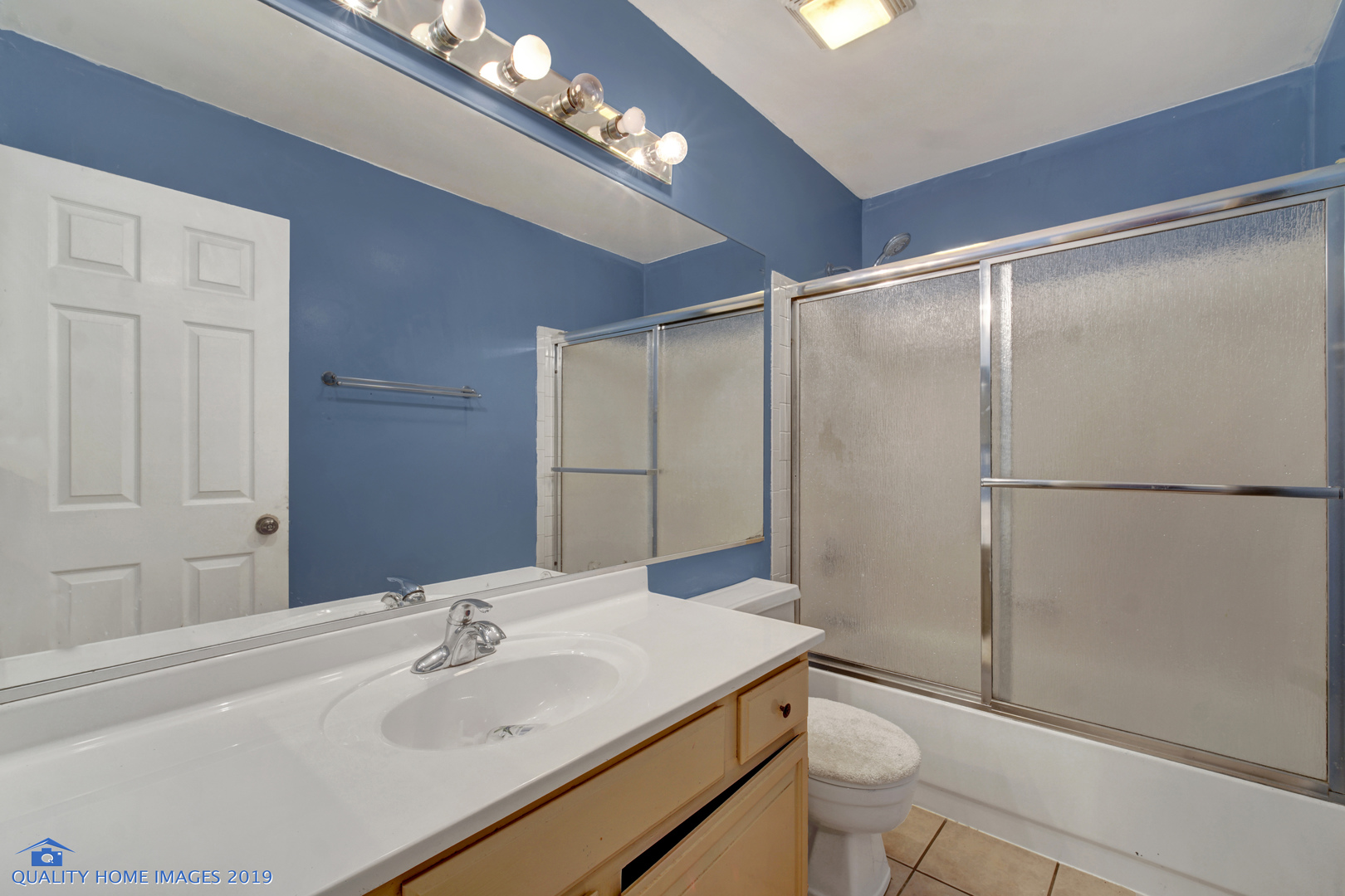 27W241 Churchill Road Winfield, IL 60190 - Photo 17 of 24 a bathroom with a sink and a mirror