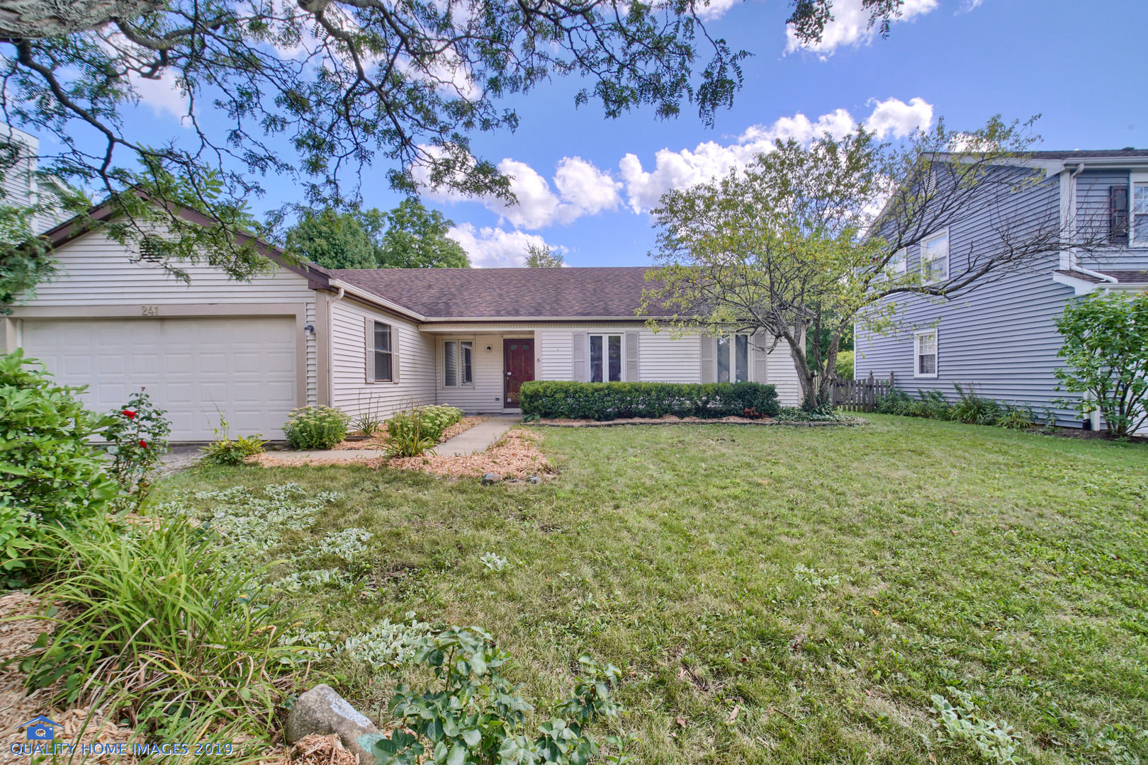 27W241 Churchill Road Winfield, IL 60190 - Photo 24 of 24 a front view of a house with garden