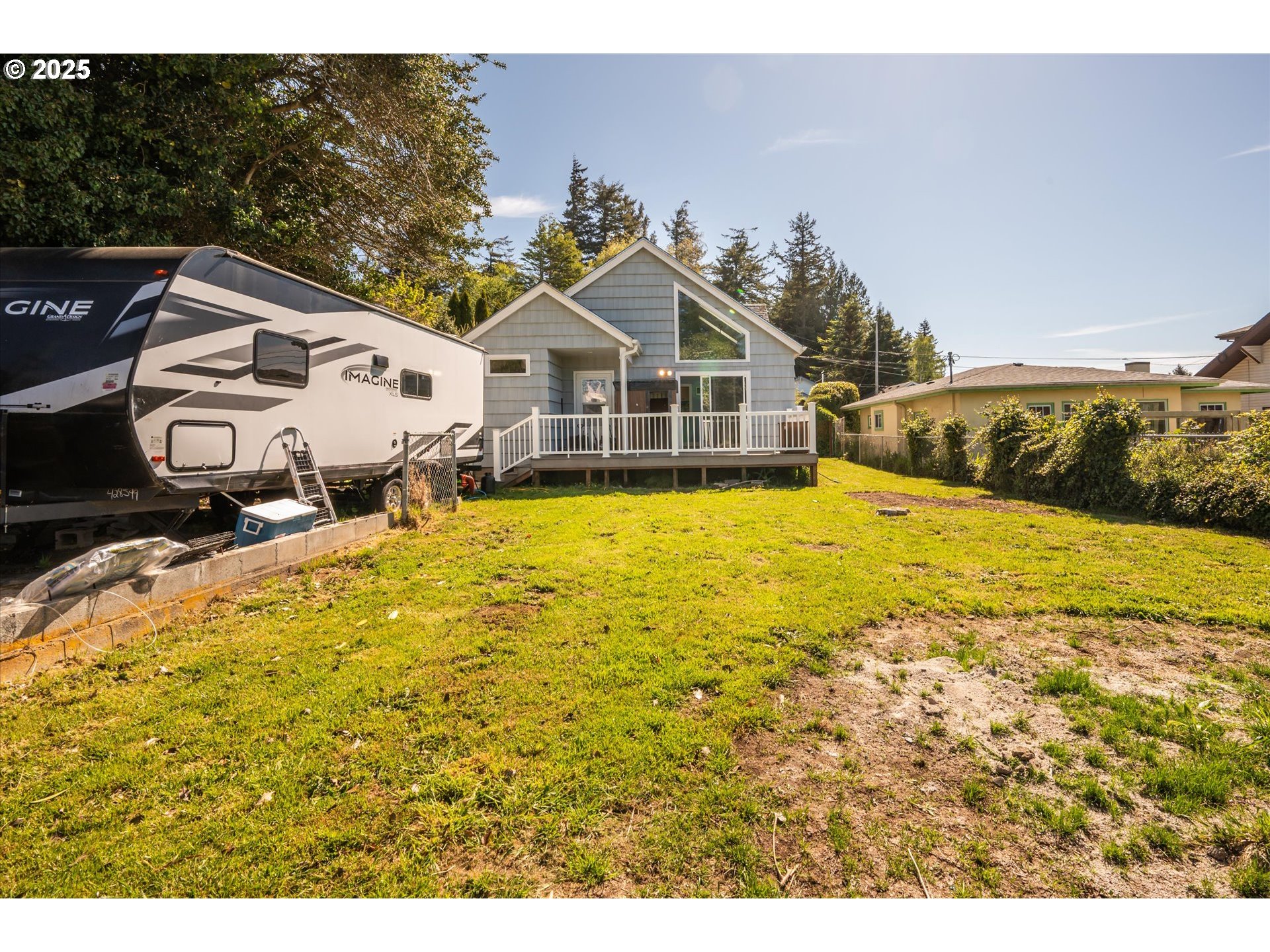 2318 Liberty Street North Bend, OR 97459 - Photo 6 of 29 a view of a house with a yard
