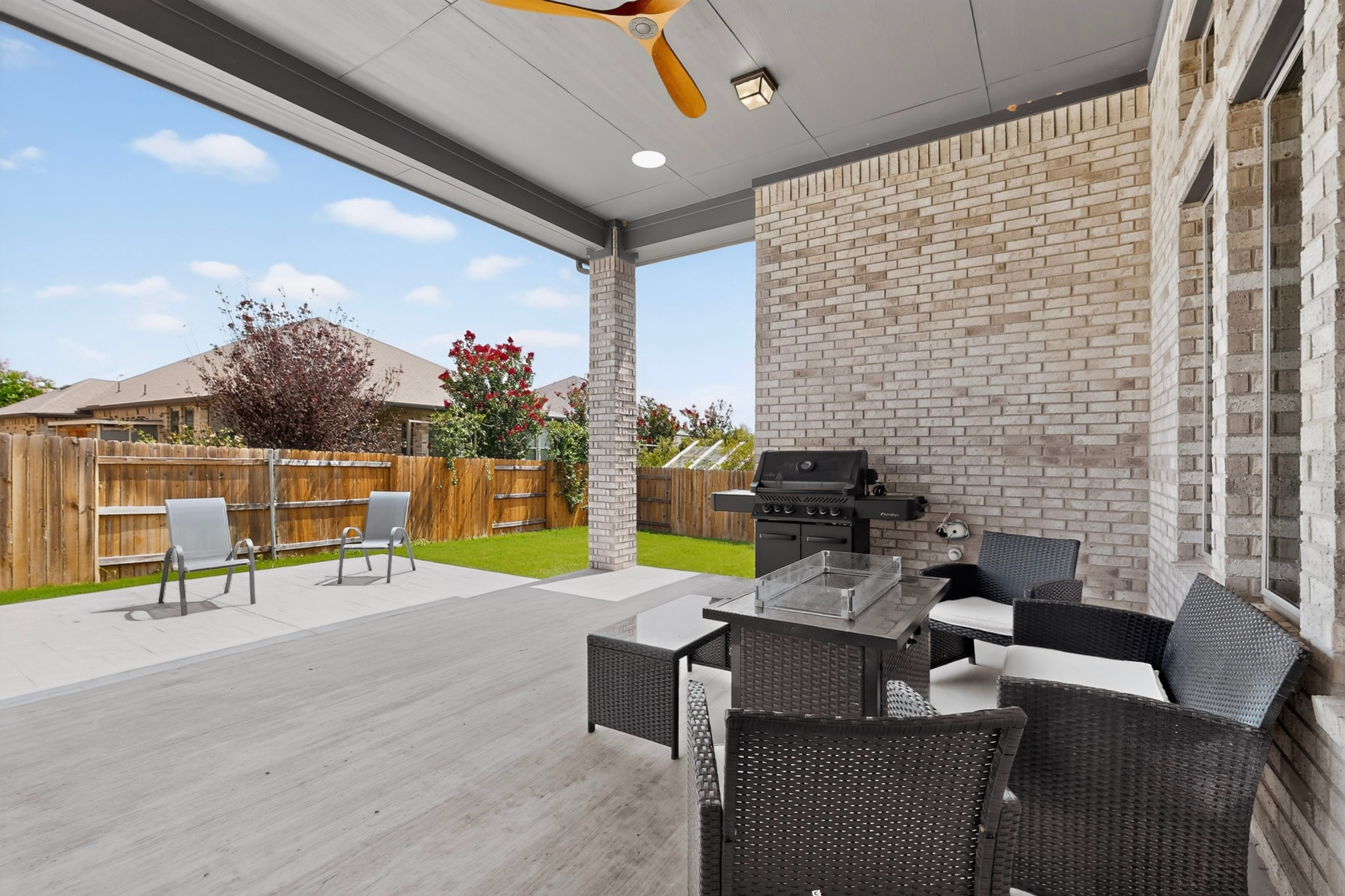 2433 La Mirada Street Leander, TX 78641 - Photo 20 of 25 An inviting covered patio offers ample space for outdoor gatherings and relaxation.