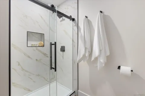 a bathroom with a shower and a shower curtain