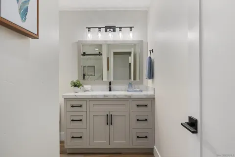 a bathroom with a sink and a mirror