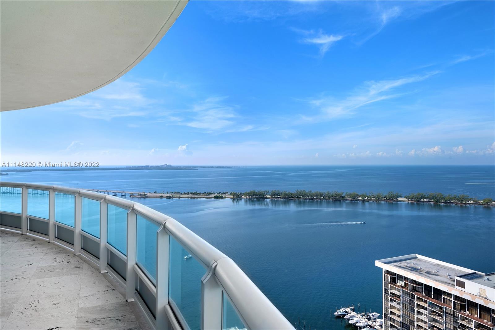 1643 Brickell Avenue, Unit 3702 Miami, FL 33129 - Photo 14 of 15 a view of a lake with city from a balcony