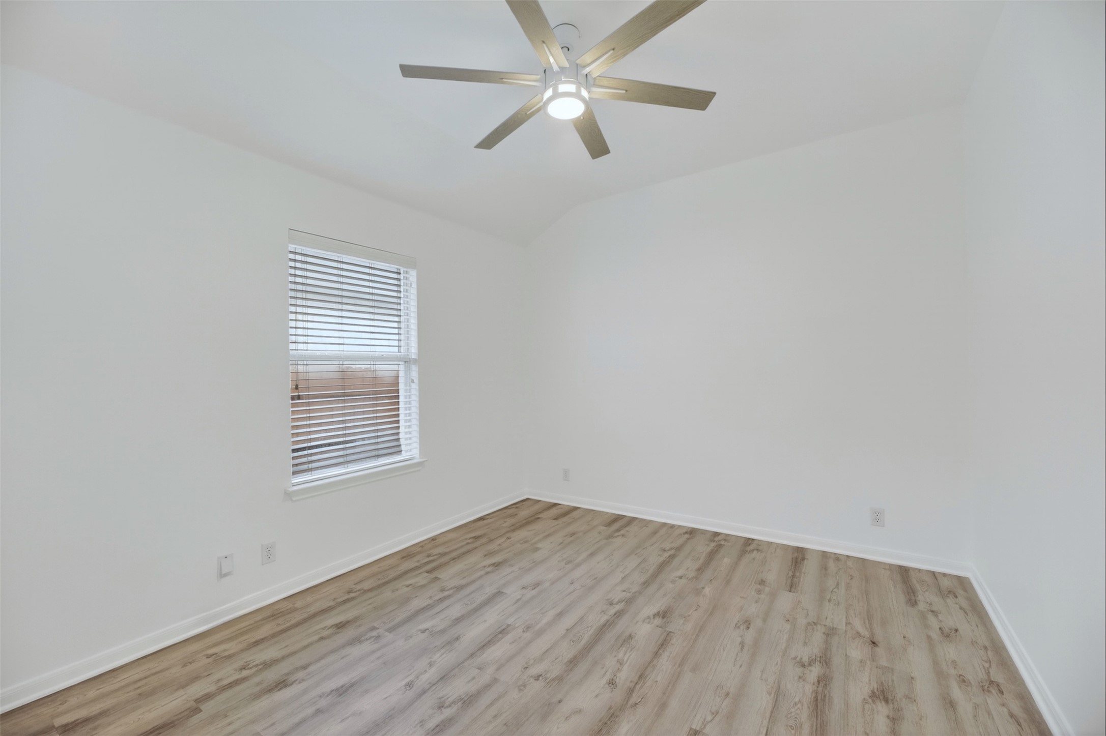 545 Manchester Lane Austin, TX 78737 - Photo 18 of 30 an empty room with a window and ceiling fan