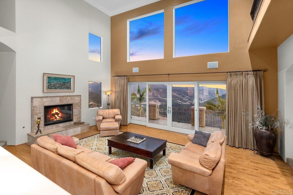 10363 Hidden Meadows Road Escondido, CA 92026 - Photo 13 of 65 a living room with furniture and a fireplace