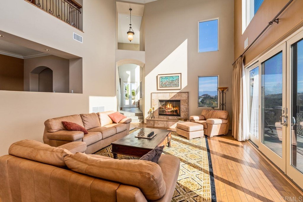 10363 Hidden Meadows Road Escondido, CA 92026 - Photo 15 of 65 a living room with furniture fireplace and a large window