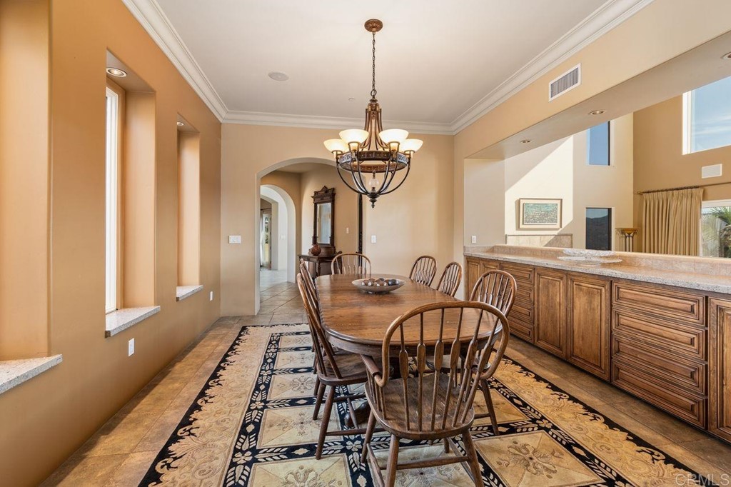 10363 Hidden Meadows Road Escondido, CA 92026 - Photo 17 of 65 a view of a dining room with furniture window and wooden floor