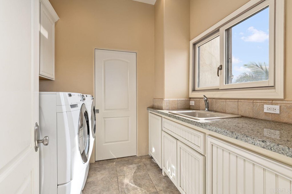 10363 Hidden Meadows Road Escondido, CA 92026 - Photo 26 of 65 a bathroom with a granite countertop sink and a mirror