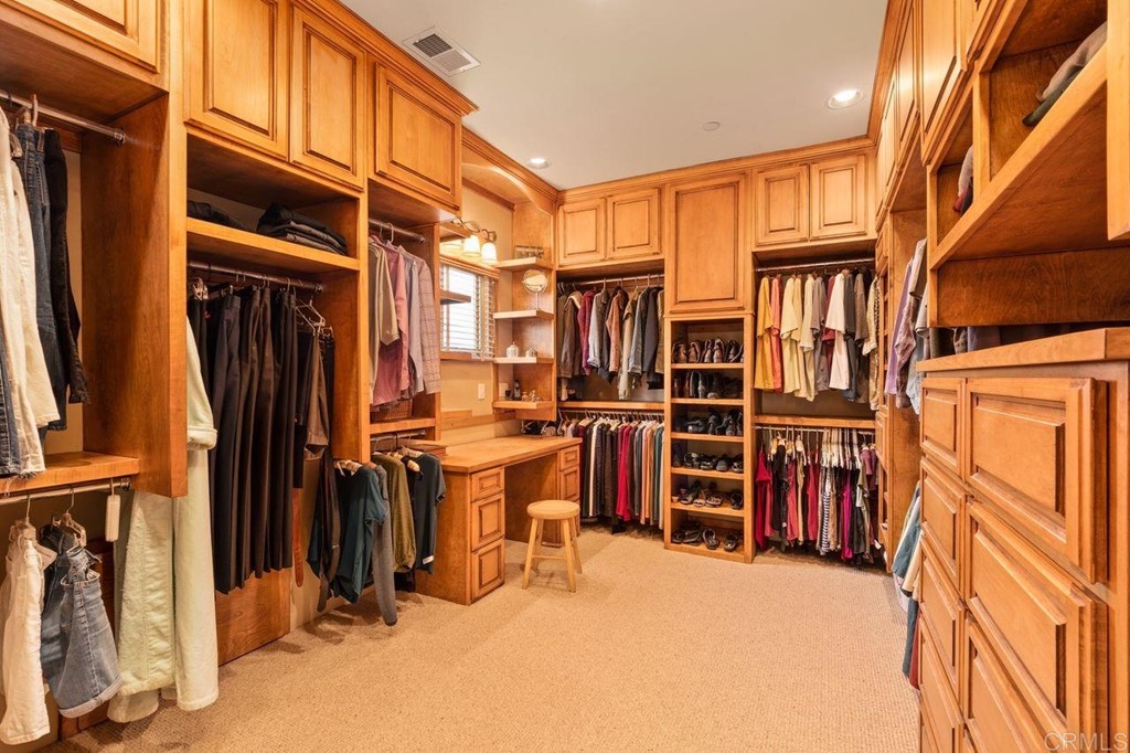 10363 Hidden Meadows Road Escondido, CA 92026 - Photo 31 of 65 a view of walk in closet with clothes