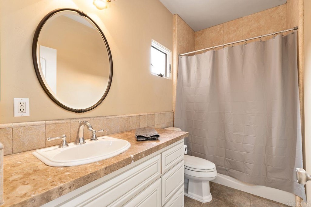 10363 Hidden Meadows Road Escondido, CA 92026 - Photo 36 of 65 a bathroom with a sink and a mirror