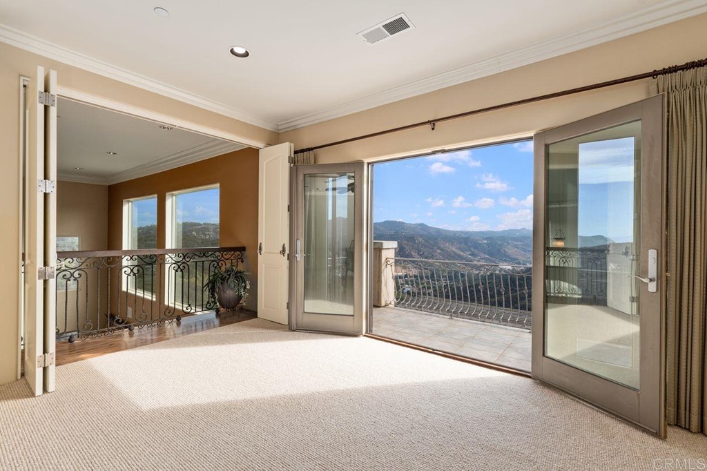 10363 Hidden Meadows Road Escondido, CA 92026 - Photo 58 of 65 a view of a hallway with a glass door and shower