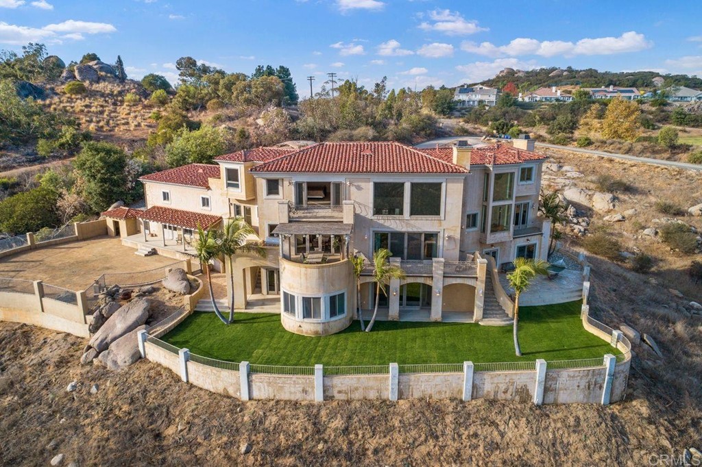 10363 Hidden Meadows Road Escondido, CA 92026 - Photo 9 of 65 a view of a house with a big yard and large trees