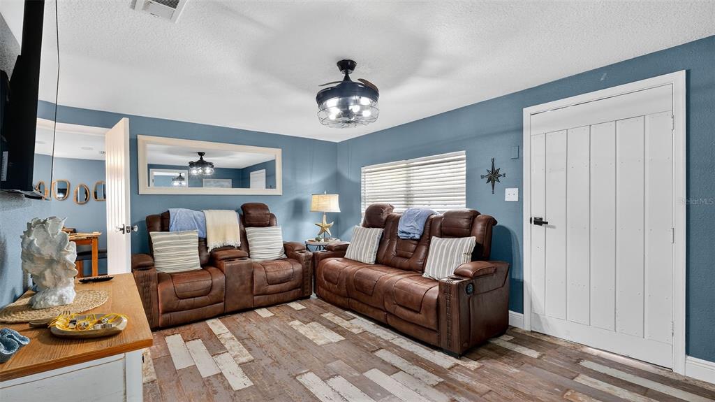 5411 Teal Drive Weeki Wachee, FL 34607 - Photo 13 of 44 a living room with furniture and a window