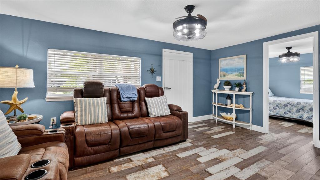 5411 Teal Drive Weeki Wachee, FL 34607 - Photo 14 of 44 a living room with furniture and a large window