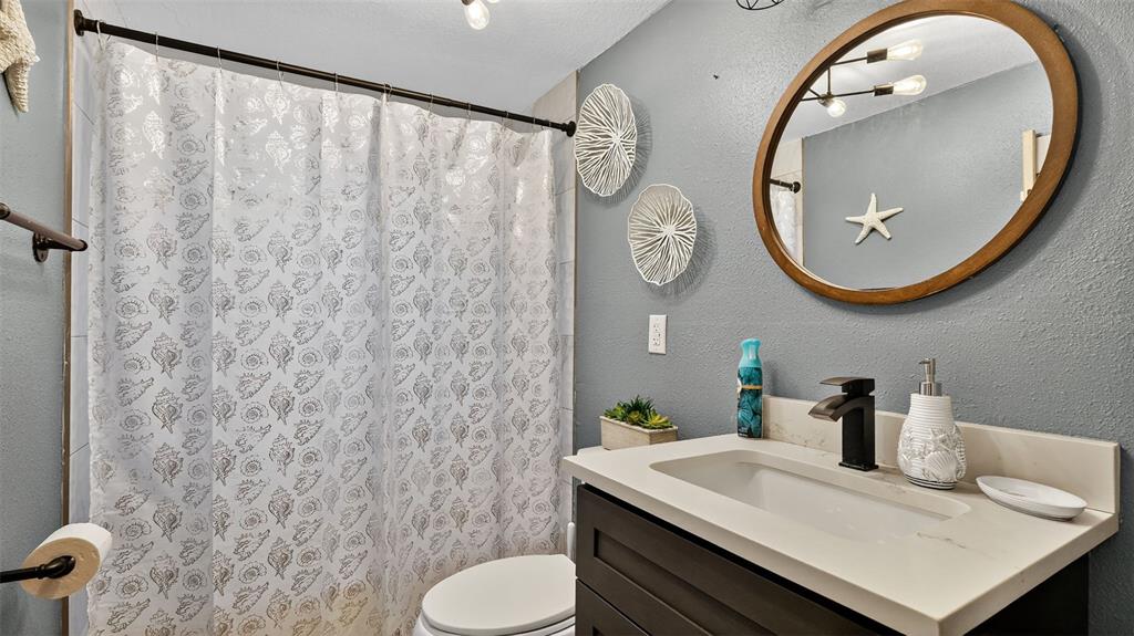 5411 Teal Drive Weeki Wachee, FL 34607 - Photo 23 of 44 a bathroom with a sink and a mirror