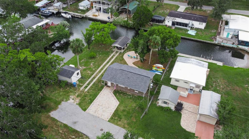 5411 Teal Drive Weeki Wachee, FL 34607 - Photo 3 of 44 an aerial view of multiple houses with yard