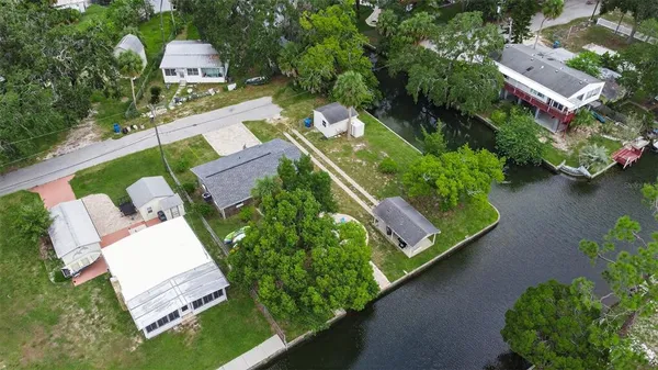 an aerial view of a house with outdoor space