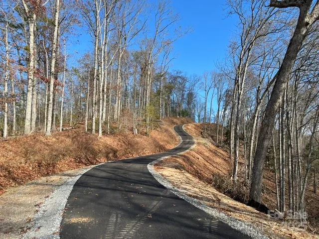 a view of a street with a building in the background