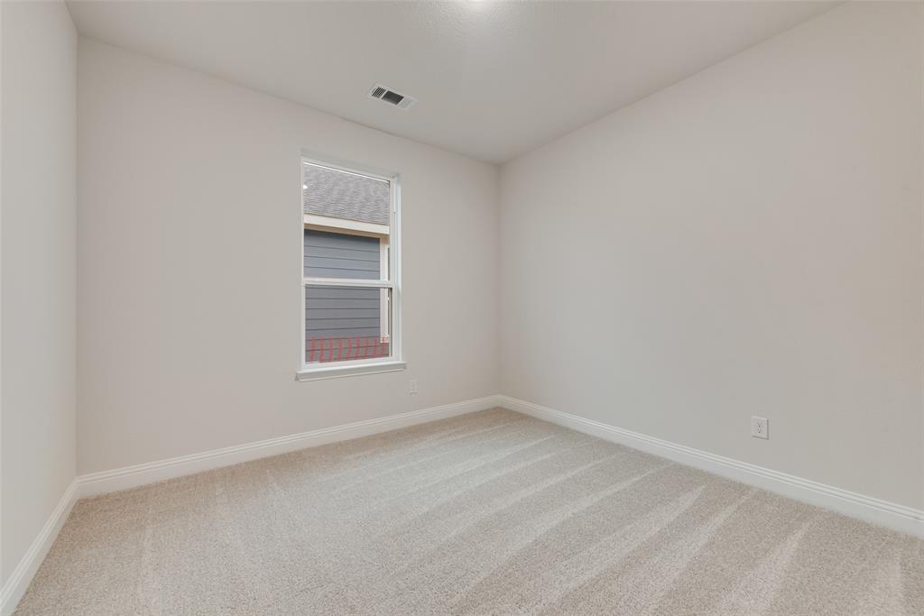 1013 Canoe Way Crowley, TX 76036 - Photo 23 of 26 a view of an empty room with a window