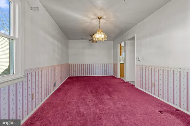 wooden floor in an empty room with windows