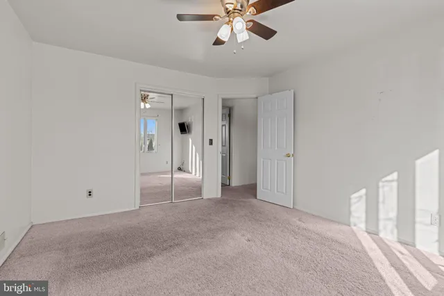 a bathroom with a bathtub sink and mirror