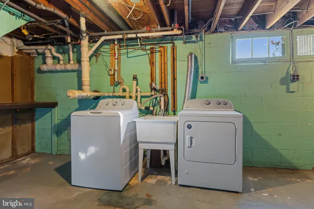a view of yard covered with snow in front of house