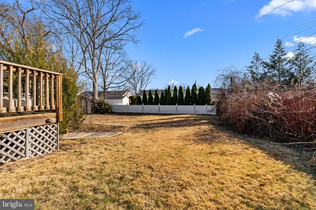 a view of a backyard with sitting area