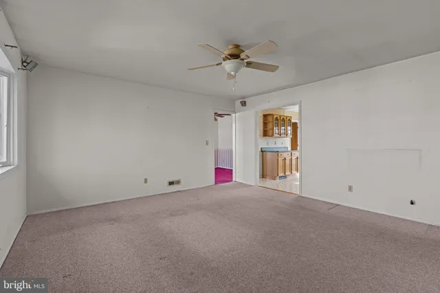 a view of empty room with windows