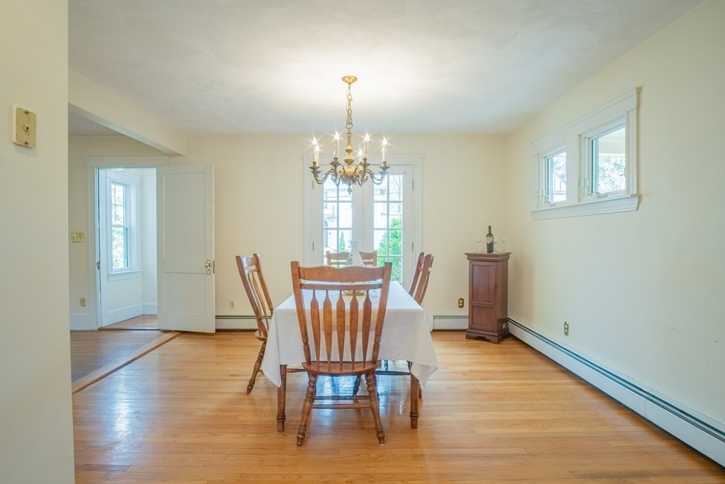 47 Pilgrim Road Marblehead, MA 01945 - Photo 11 of 42 a view of a dining room with furniture window and wooden floor