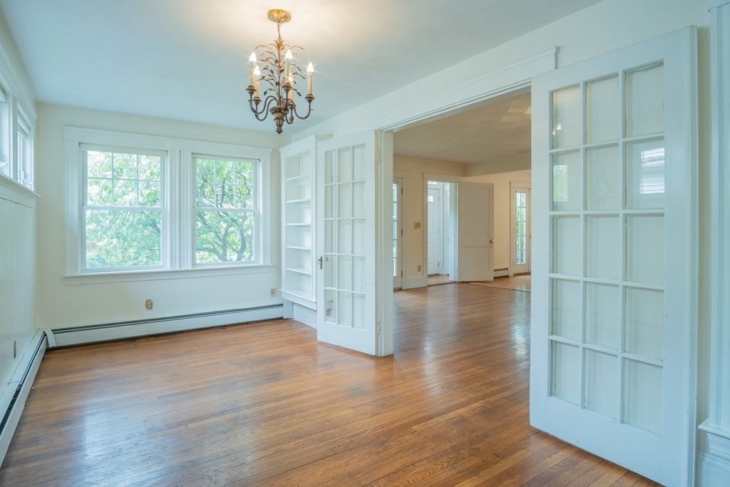 47 Pilgrim Road Marblehead, MA 01945 - Photo 13 of 42 an empty room with wooden floor and windows