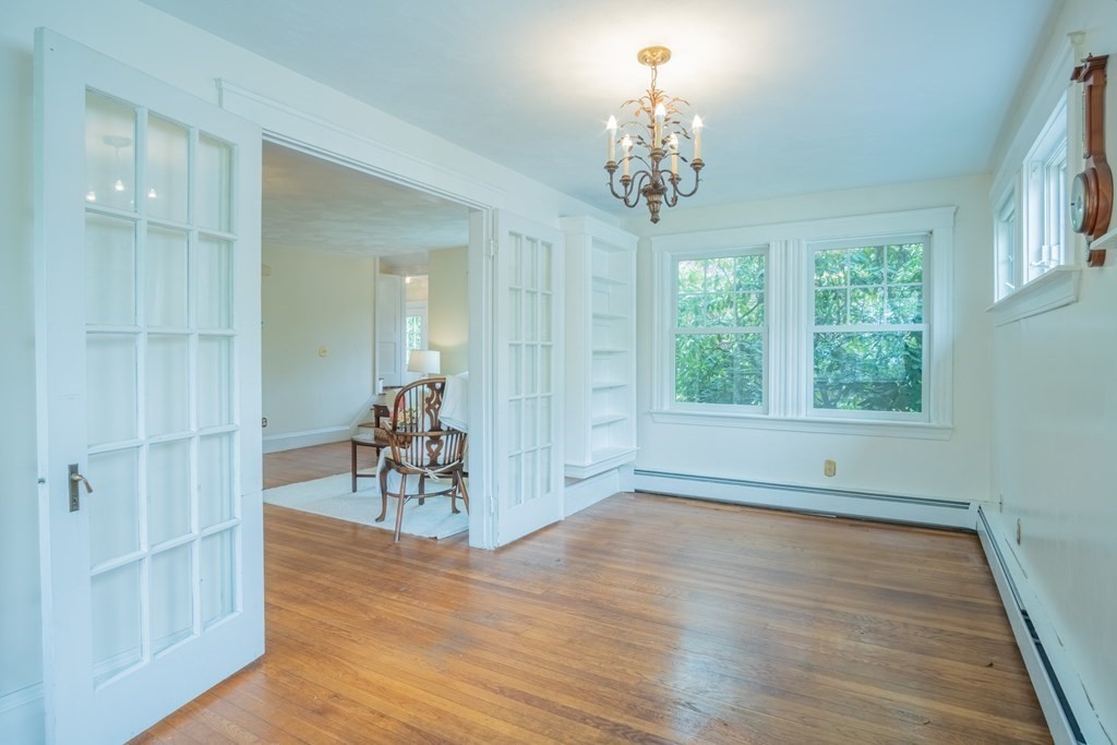 47 Pilgrim Road Marblehead, MA 01945 - Photo 14 of 42 wooden floor in an empty room with a window