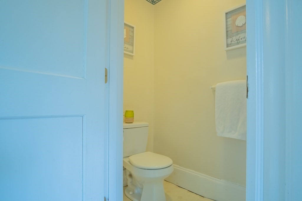 47 Pilgrim Road Marblehead, MA 01945 - Photo 15 of 42 a white toilet sitting next to a shower curtain