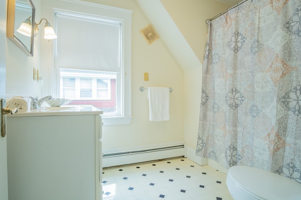 47 Pilgrim Road Marblehead, MA 01945 - Photo 22 of 42 a bathroom with a granite countertop sink a toilet and shower