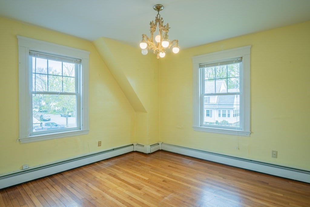 47 Pilgrim Road Marblehead, MA 01945 - Photo 23 of 42 a view of an empty room with wooden floor and a window
