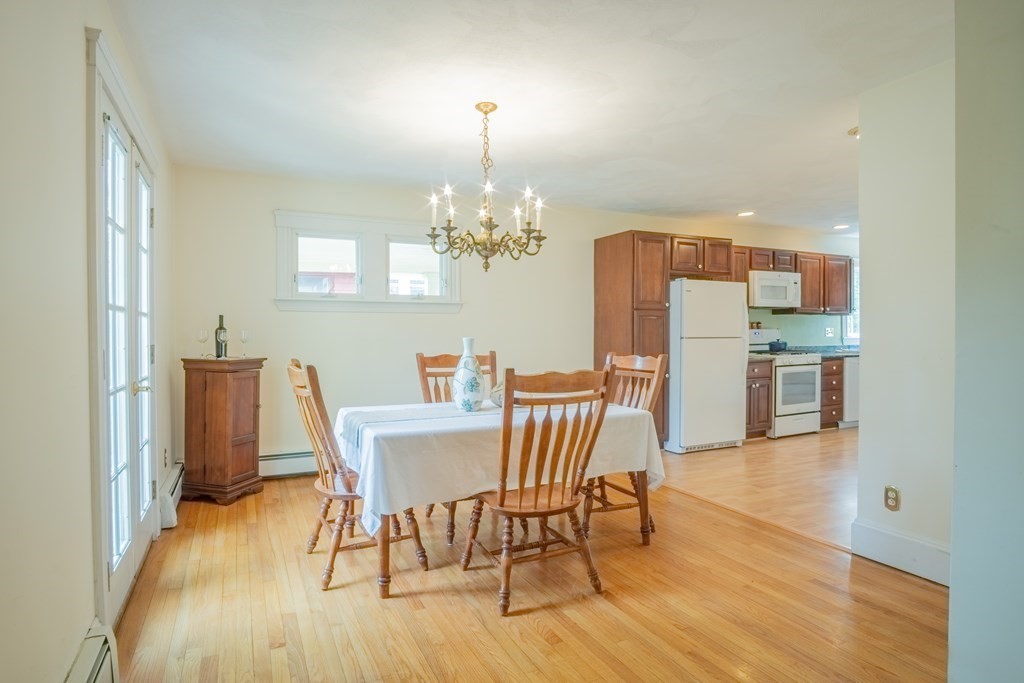 47 Pilgrim Road Marblehead, MA 01945 - Photo 10 of 42 a view of a dining room with furniture and wooden floor