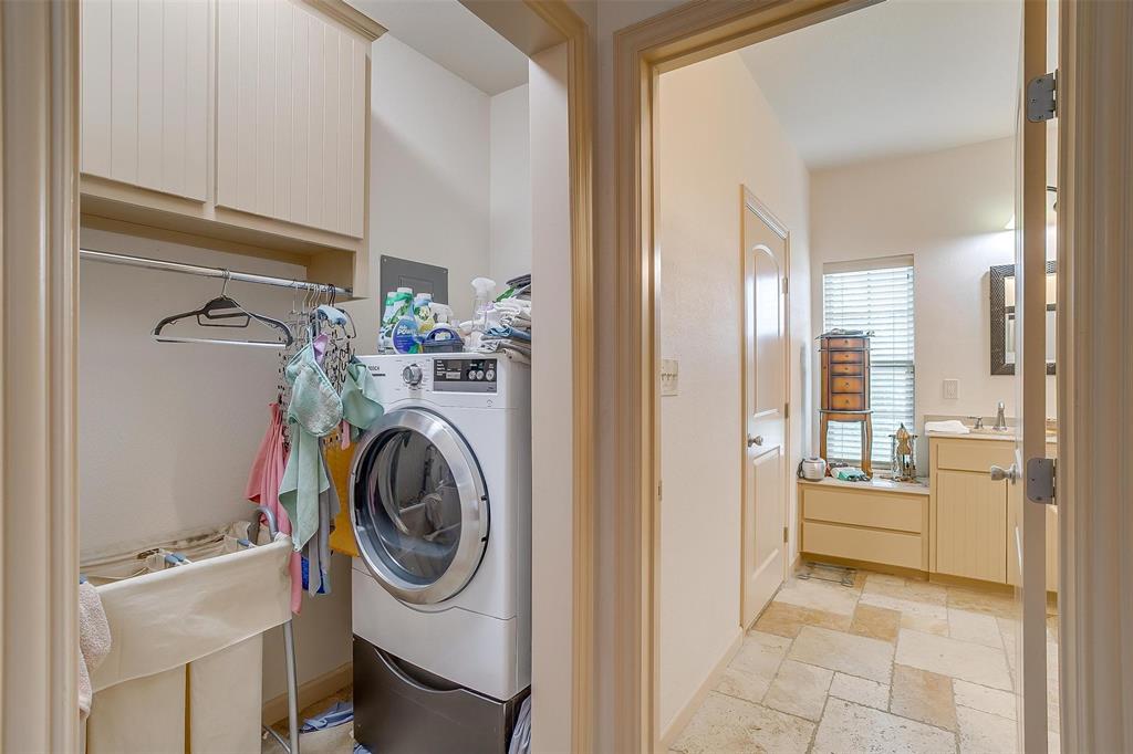 383 County Road 3672 Springtown, TX 76082 - Photo 15 of 39 Laundry room featuring stone tile floors and washer / dryer