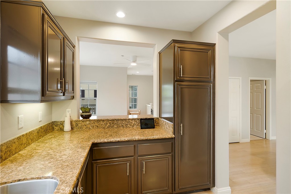 60 Strawflower Street Ladera Ranch, CA 92694 - Photo 12 of 34 a bathroom with a granite countertop sink and a mirror