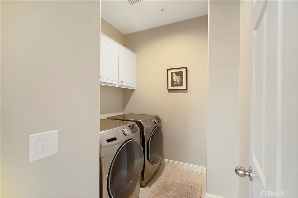 60 Strawflower Street Ladera Ranch, CA 92694 - Photo 13 of 34 a view of storage and utility room with washer and dryer