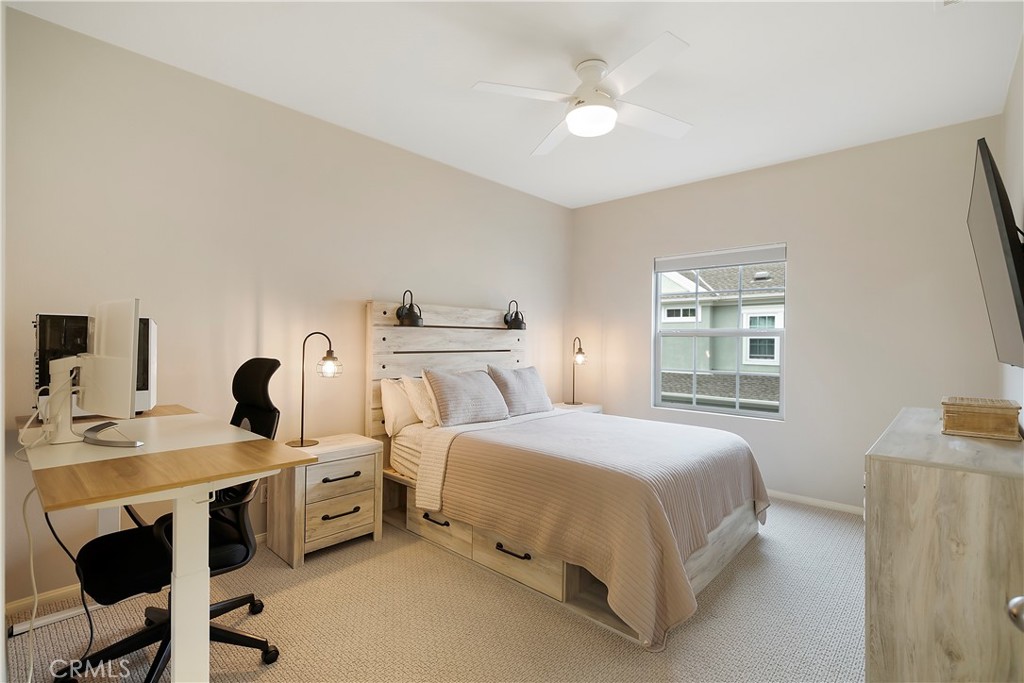 60 Strawflower Street Ladera Ranch, CA 92694 - Photo 16 of 34 a bedroom with a bed and a table in it