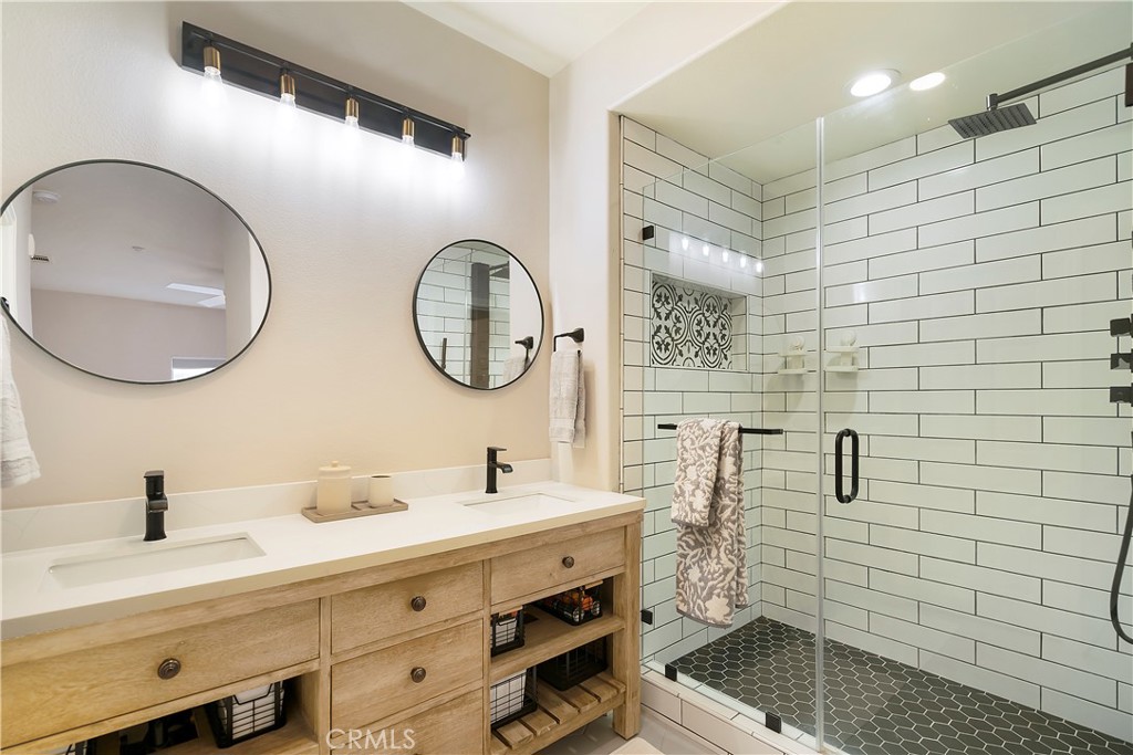 60 Strawflower Street Ladera Ranch, CA 92694 - Photo 18 of 34 a bathroom with a double vanity sink mirror and toilet
