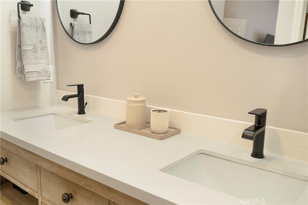 60 Strawflower Street Ladera Ranch, CA 92694 - Photo 22 of 34 a bathroom with a sink and a mirror