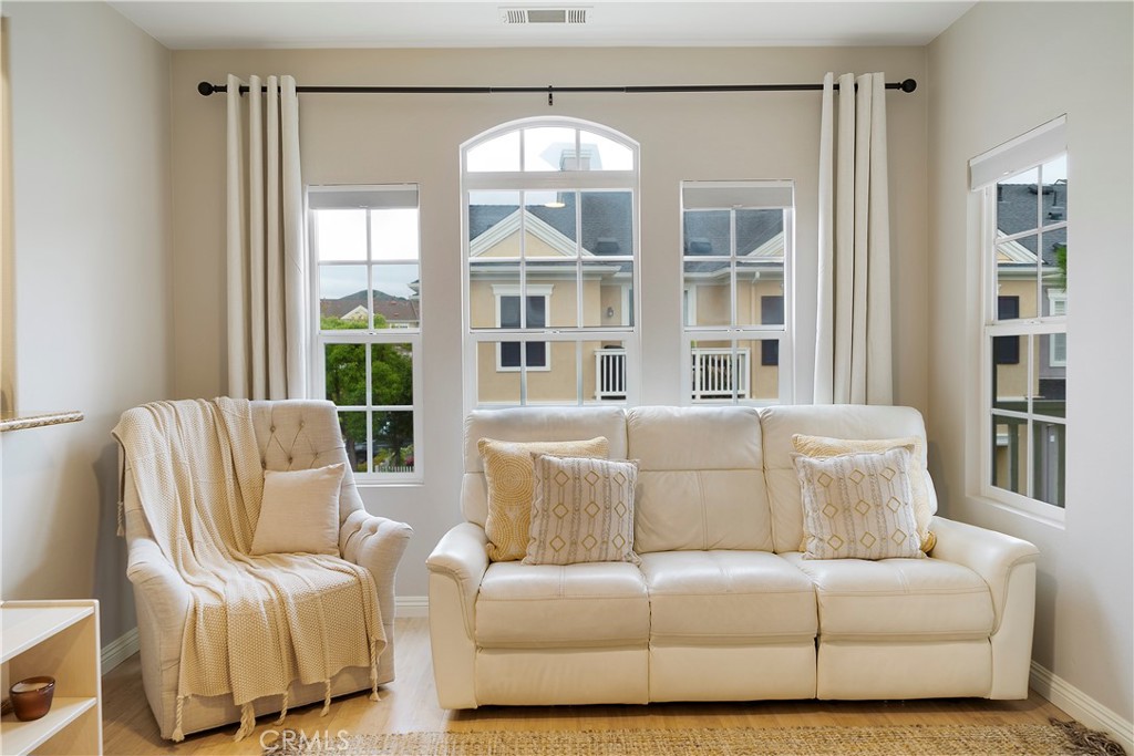 60 Strawflower Street Ladera Ranch, CA 92694 - Photo 24 of 34 a living room with furniture and a large window