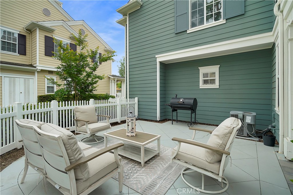60 Strawflower Street Ladera Ranch, CA 92694 - Photo 27 of 34 a view of a patio with a chairs and table in a patio