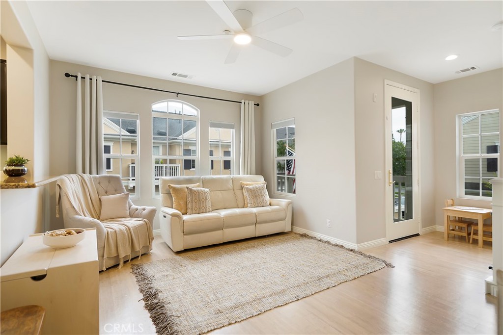 60 Strawflower Street Ladera Ranch, CA 92694 - Photo 8 of 34 a living room with furniture and a large window