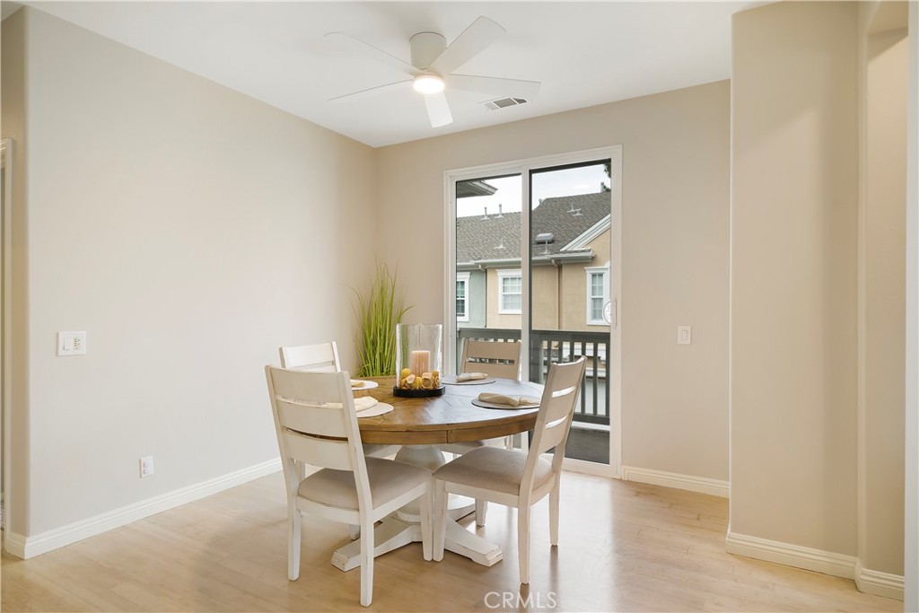 60 Strawflower Street Ladera Ranch, CA 92694 - Photo 9 of 34 a view of a dining room with furniture and wooden floor