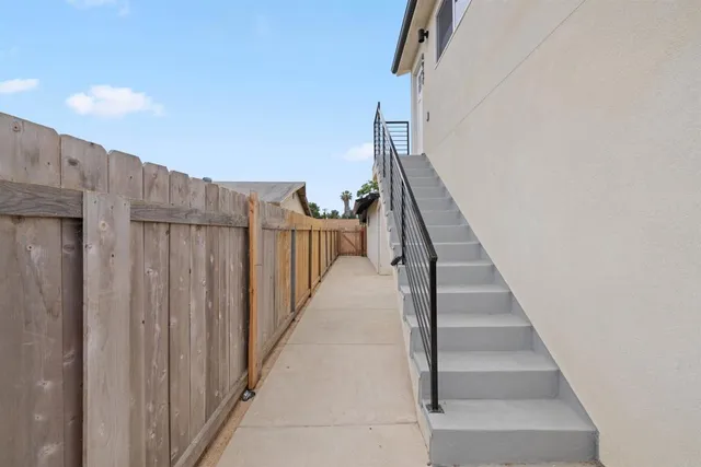 a living room with furniture a rug and a flat screen tv