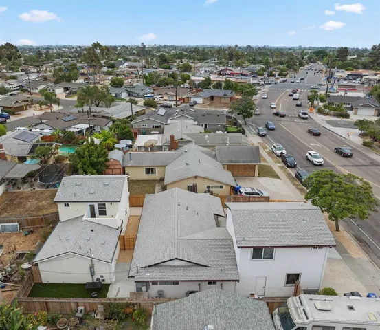 an aerial view of residential houses with outdoor space