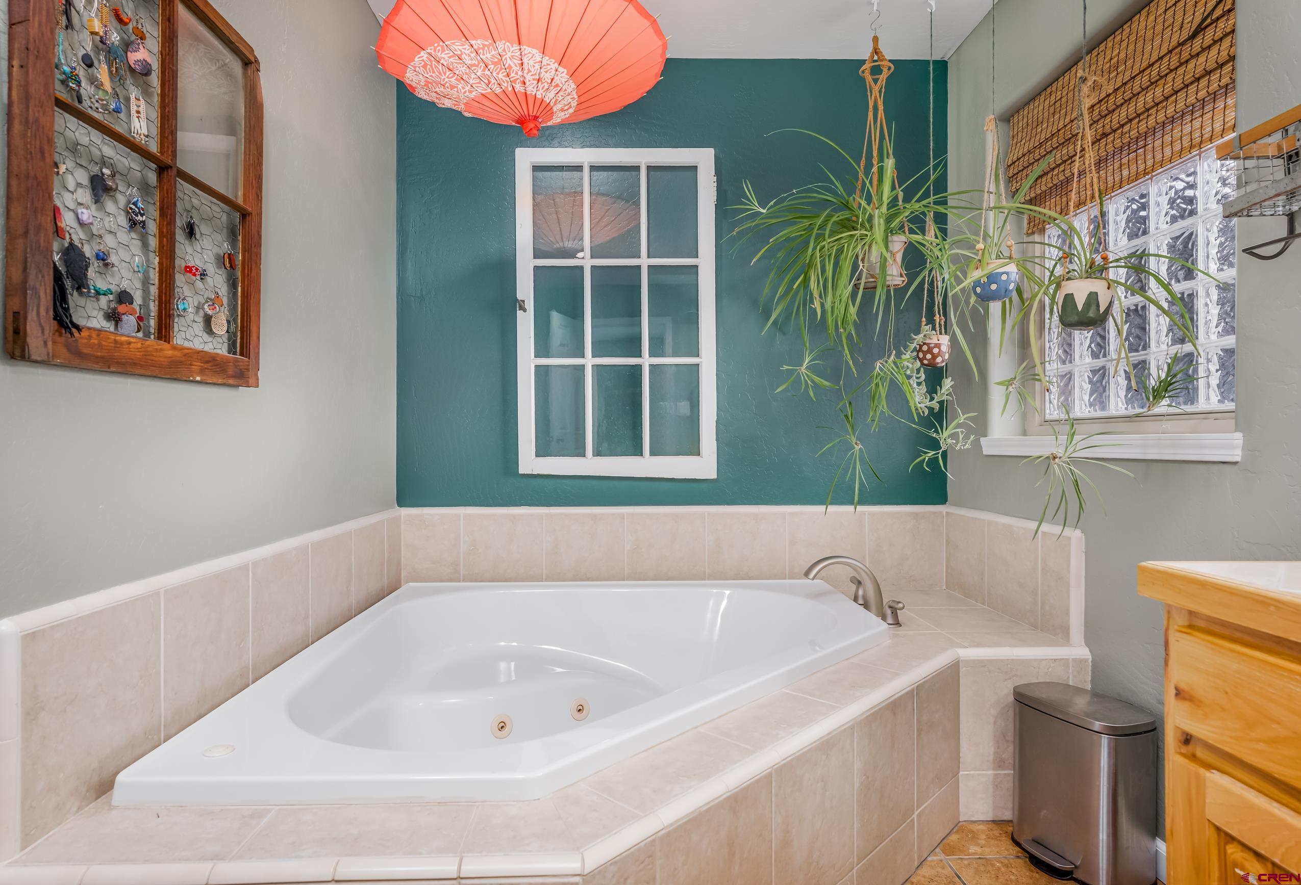 517 Dove Ranch Road Bayfield, CO 81122 - Photo 12 of 29 a white bath tub sitting next to a blue sink